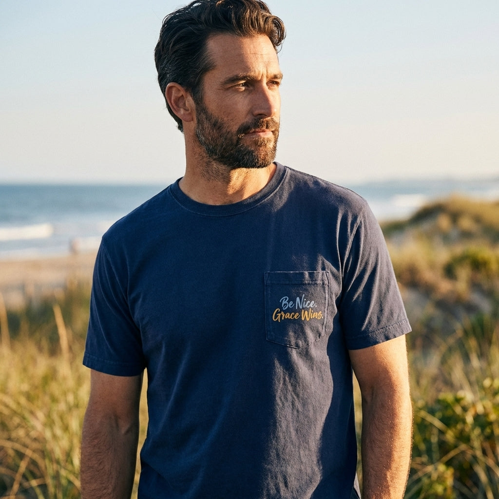 Man wearing the Everyday Pocket Tee in Navy near the beach