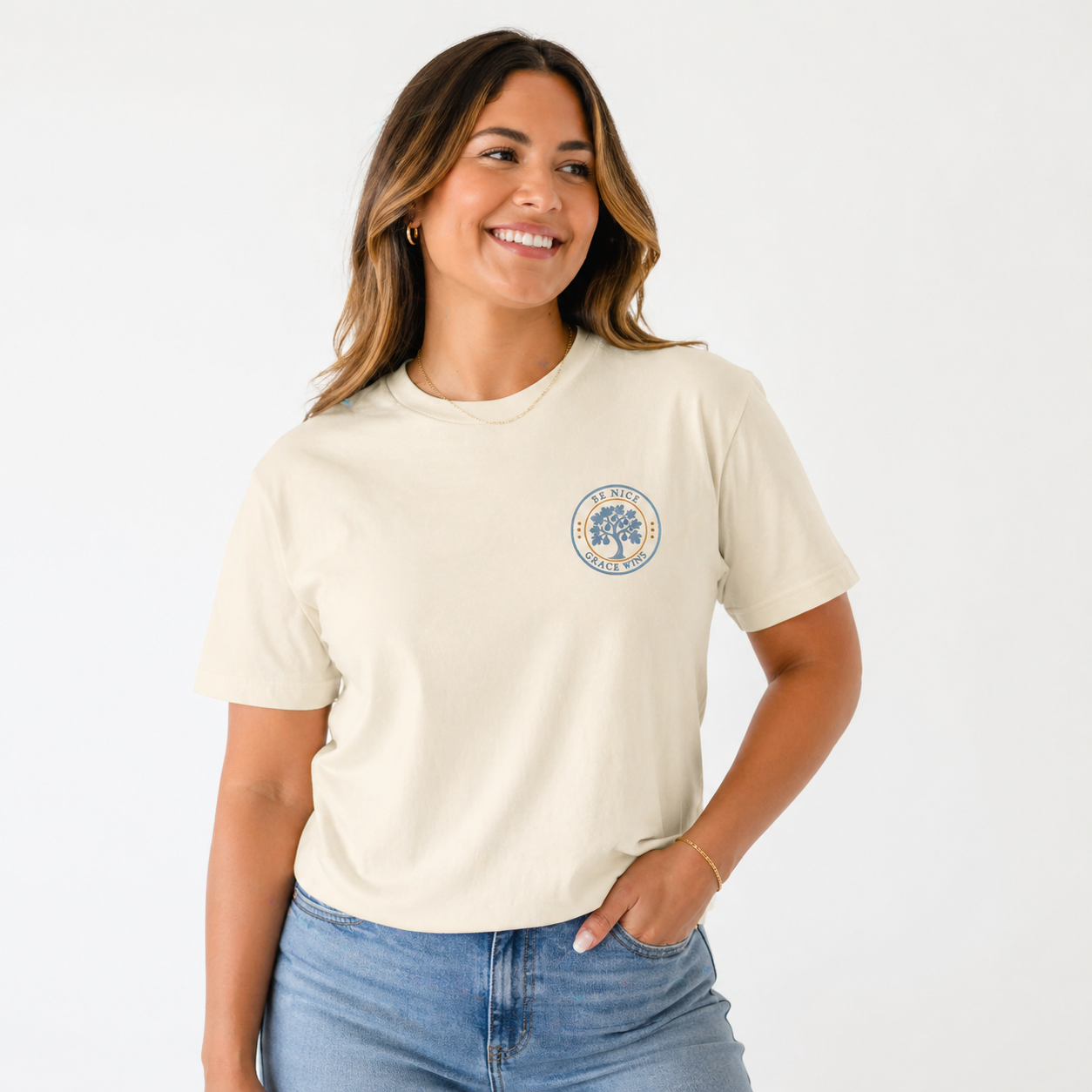 Woman wearing the Fig Tree Pocket Tee in Ivory on a white studio background