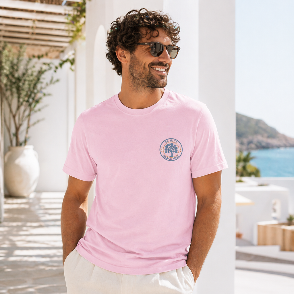 Man wearing the Fig Tree Pocket Tee in Blossom by a window