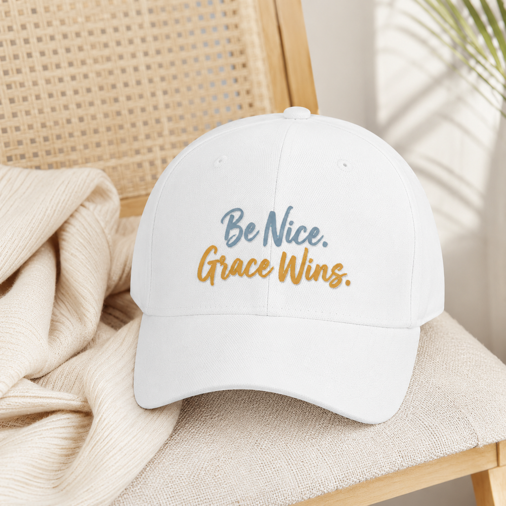 Be Nice Grace Wins Structured Cap in White styled on a neutral chair